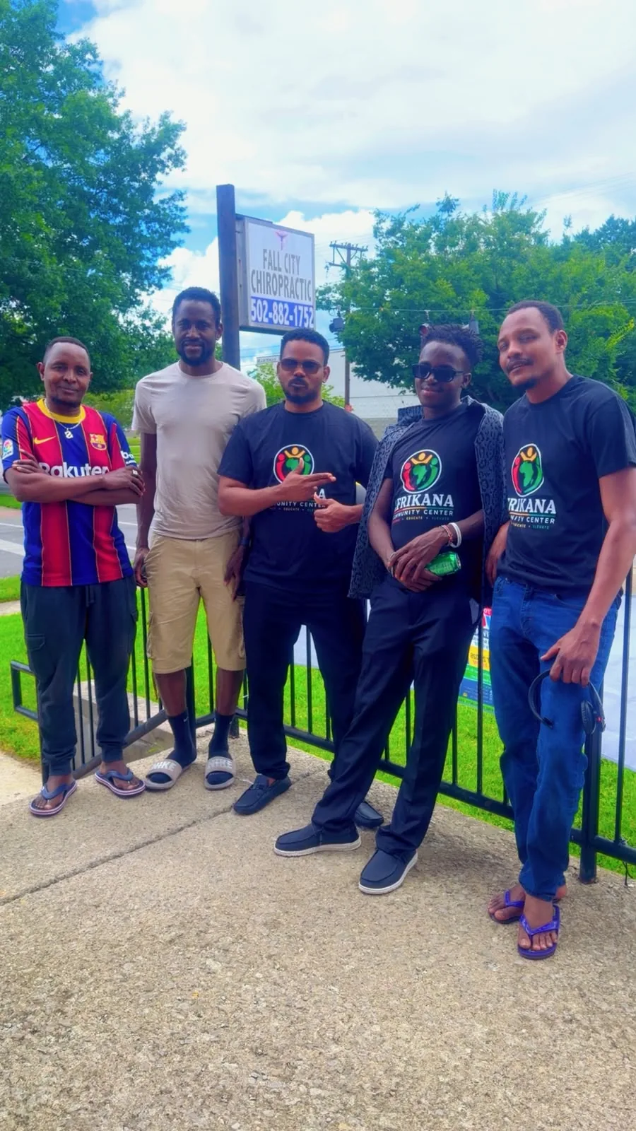 Afrikana community members and volunteers outside the West Broadway center.
