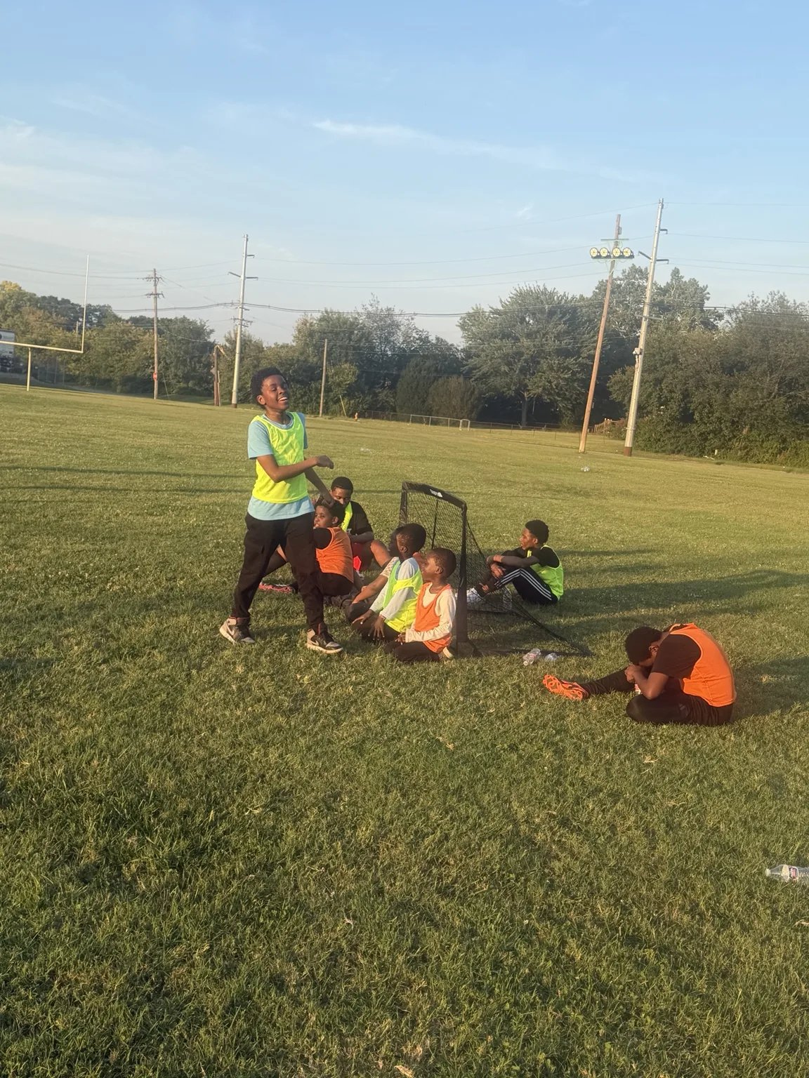 Young Afrikana United participant smiling during a 2026 soccer practice