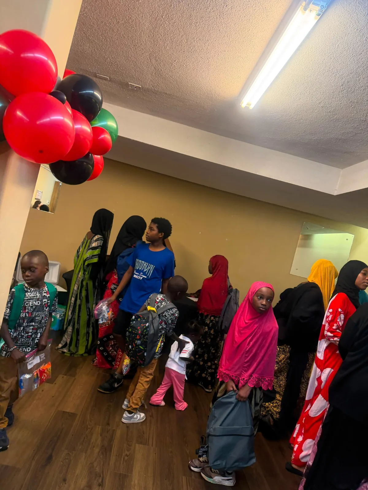 Children and families gathered inside Afrikana Community Center.