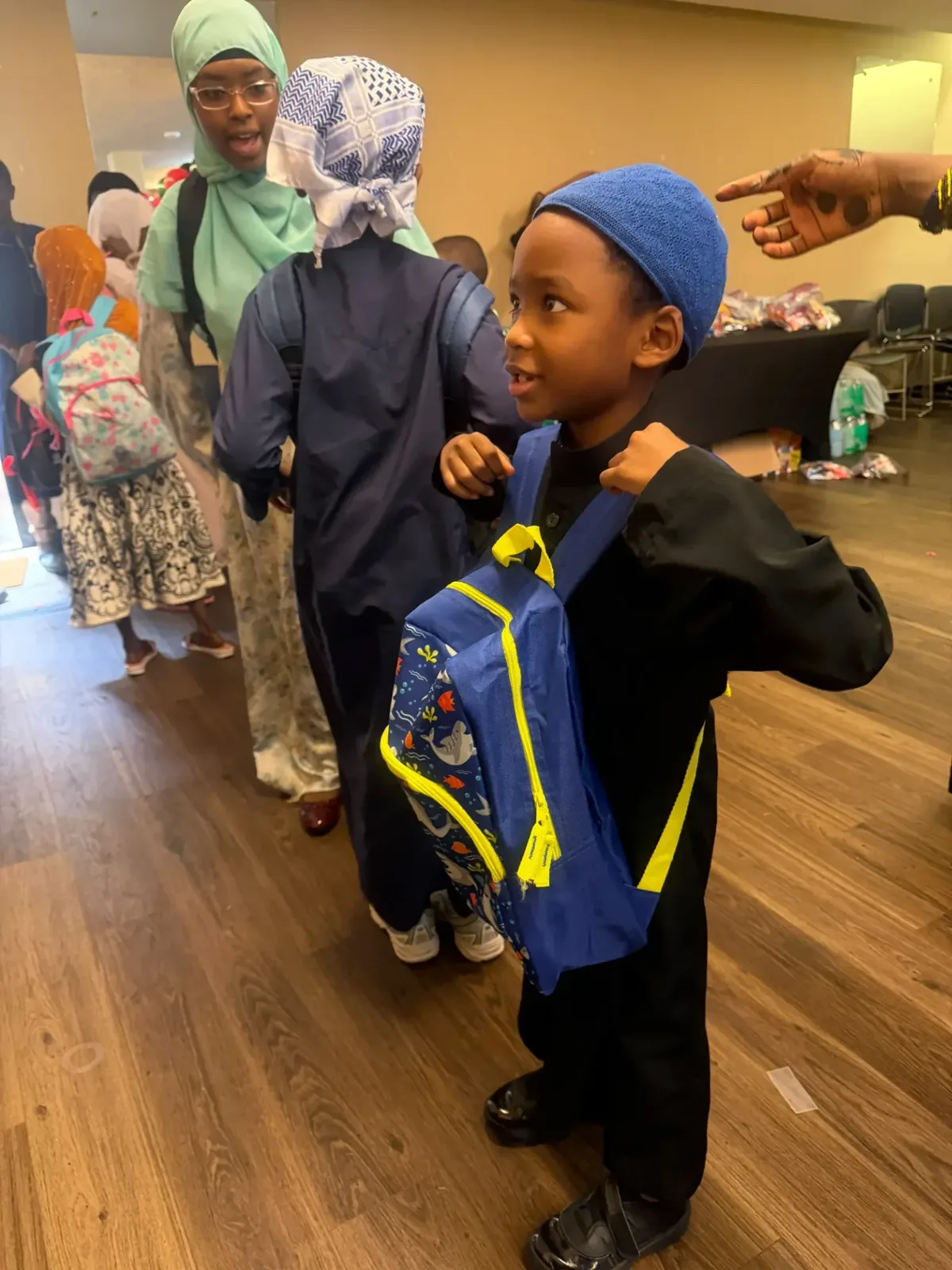Families gathered at Afrikana Community Center during the 2026 giveaway